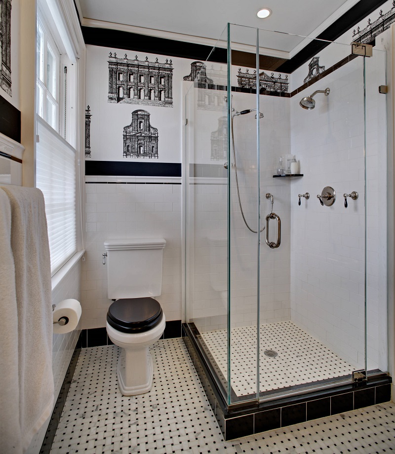 white toilet with black seat